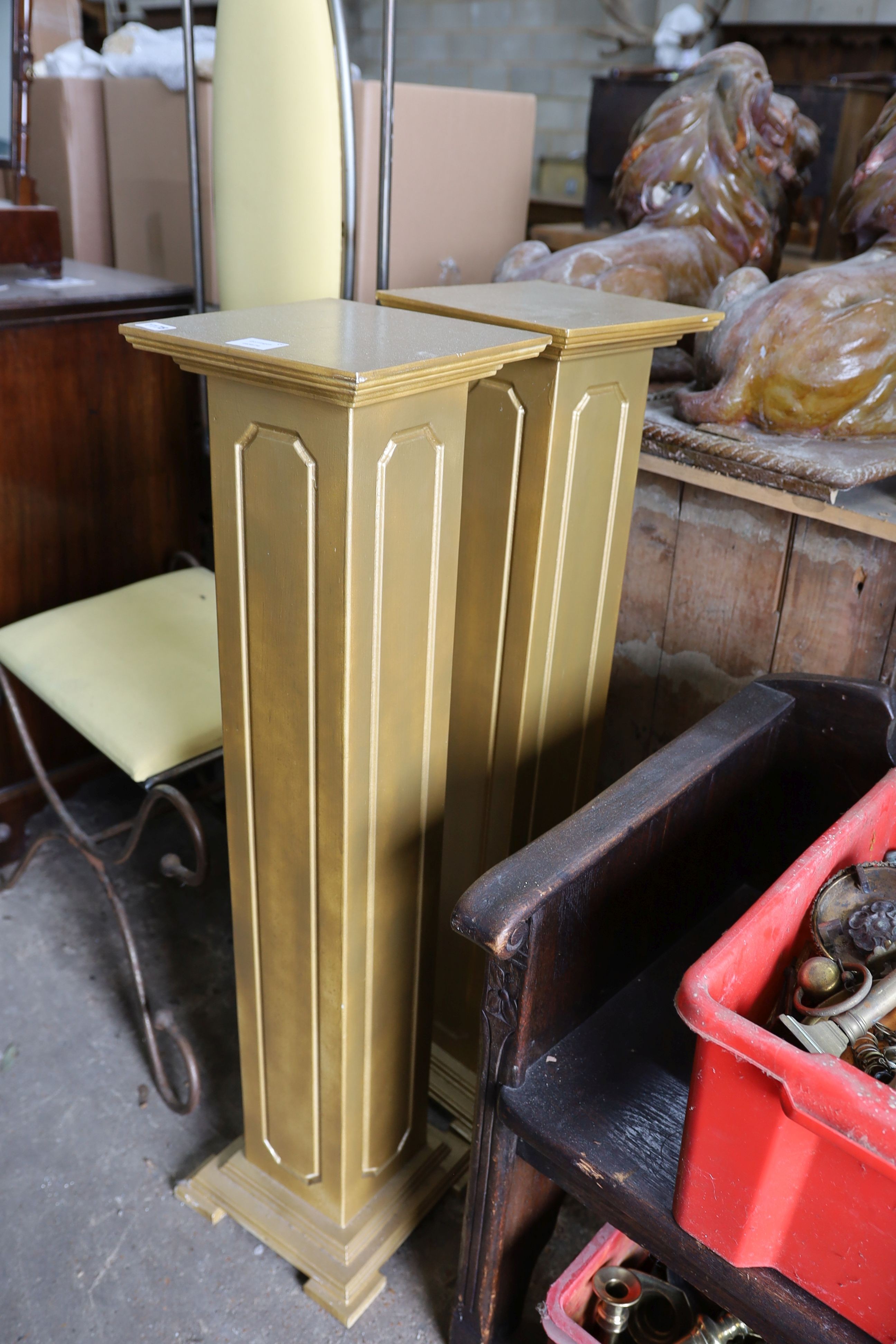 A pair of gold painted pedestals, height 108cm